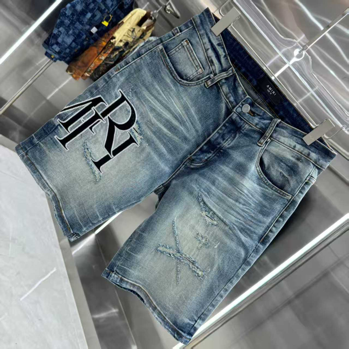 Ripped letter embroidered jeans