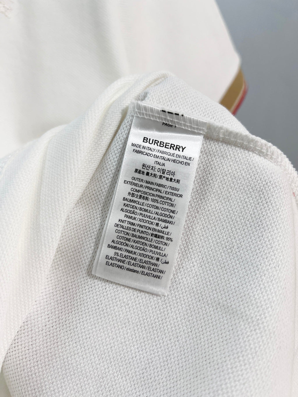 Color blocked flat machine collar with dark embroidery letters polo shirt