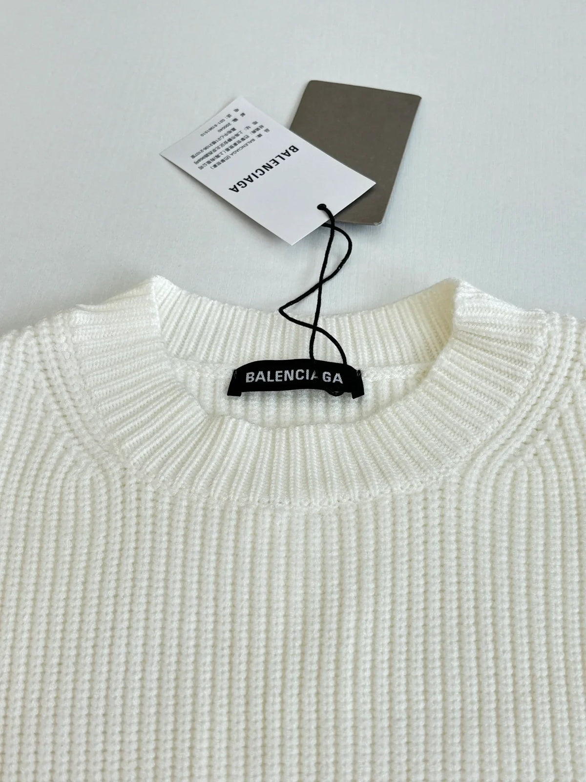 Knitted round neck sweater with armband