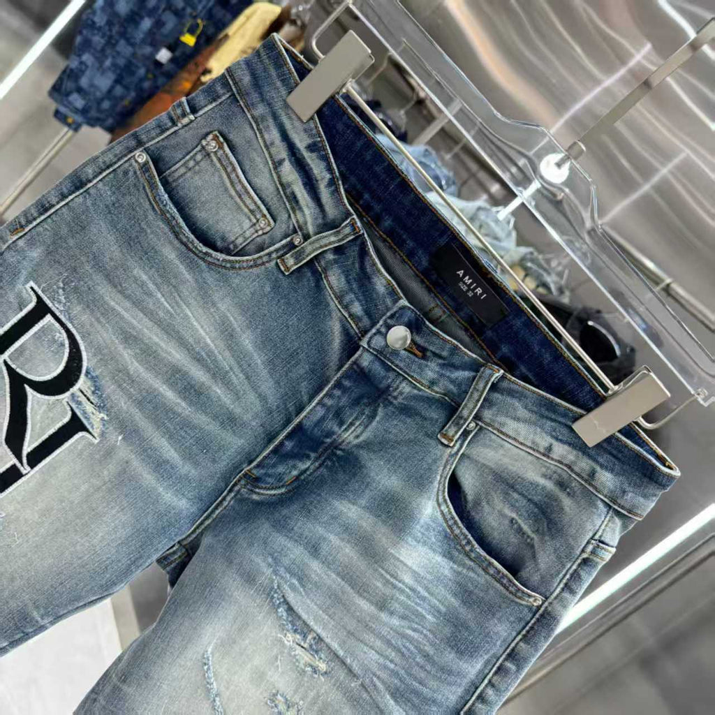 Ripped letter embroidered jeans