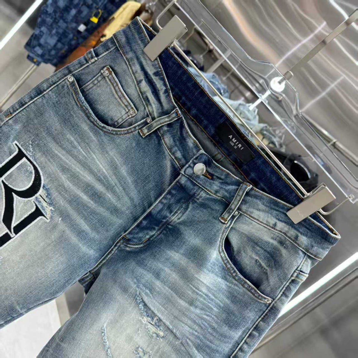 Ripped letter embroidered jeans