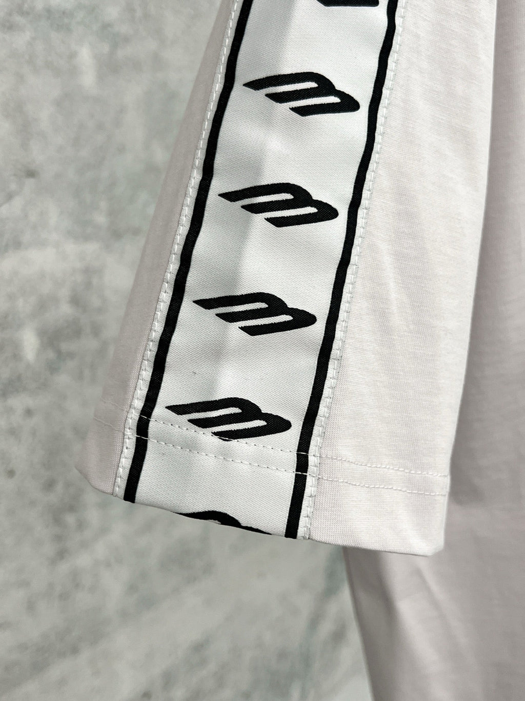 Artistic woven ribbon embellishment, washed and worn short sleeved T-shirt