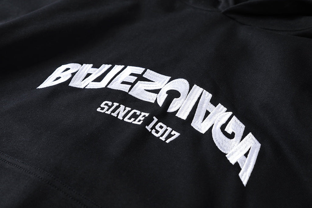 Reverse garbled letter embroidery hooded sweatshirt