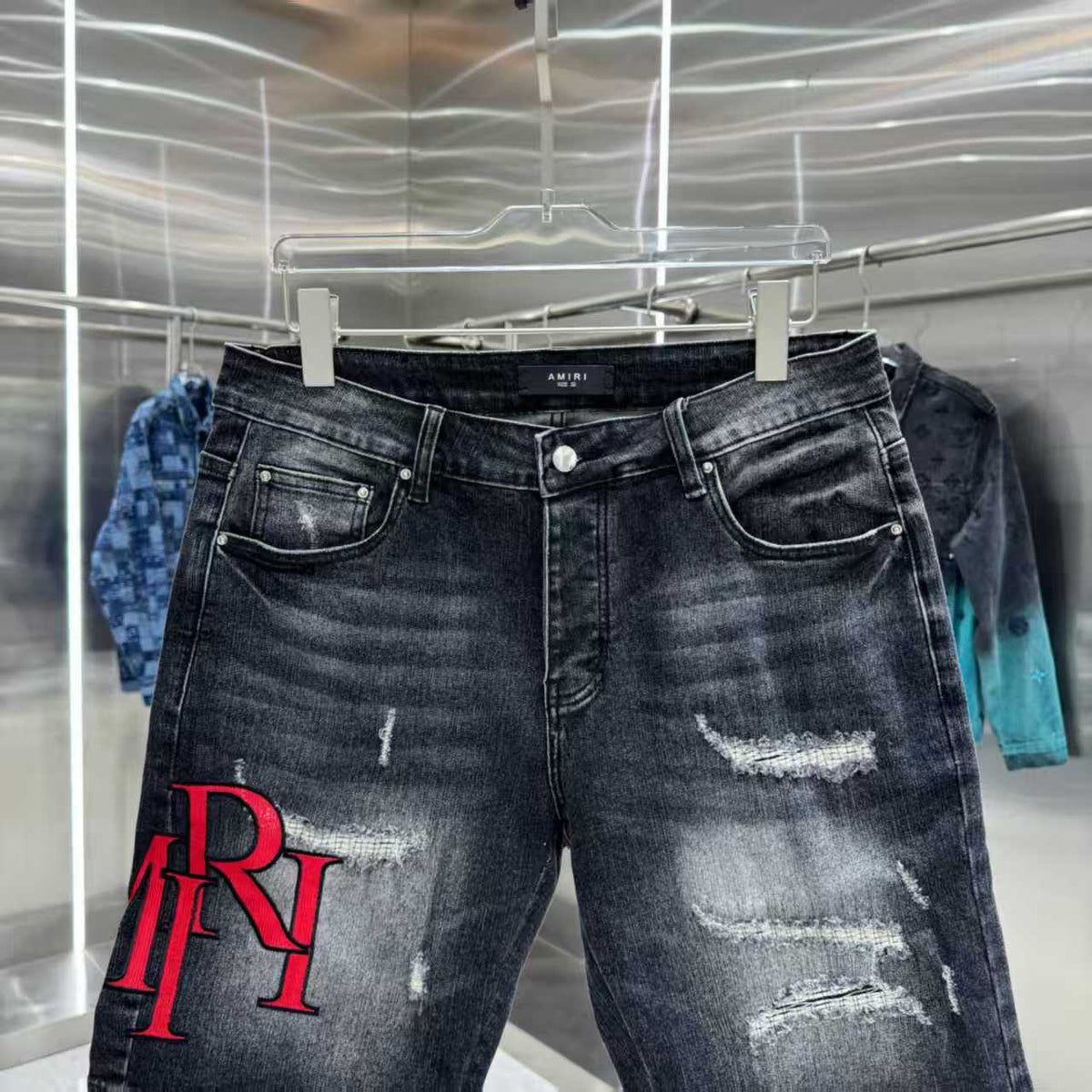 Ripped letter embroidered jeans