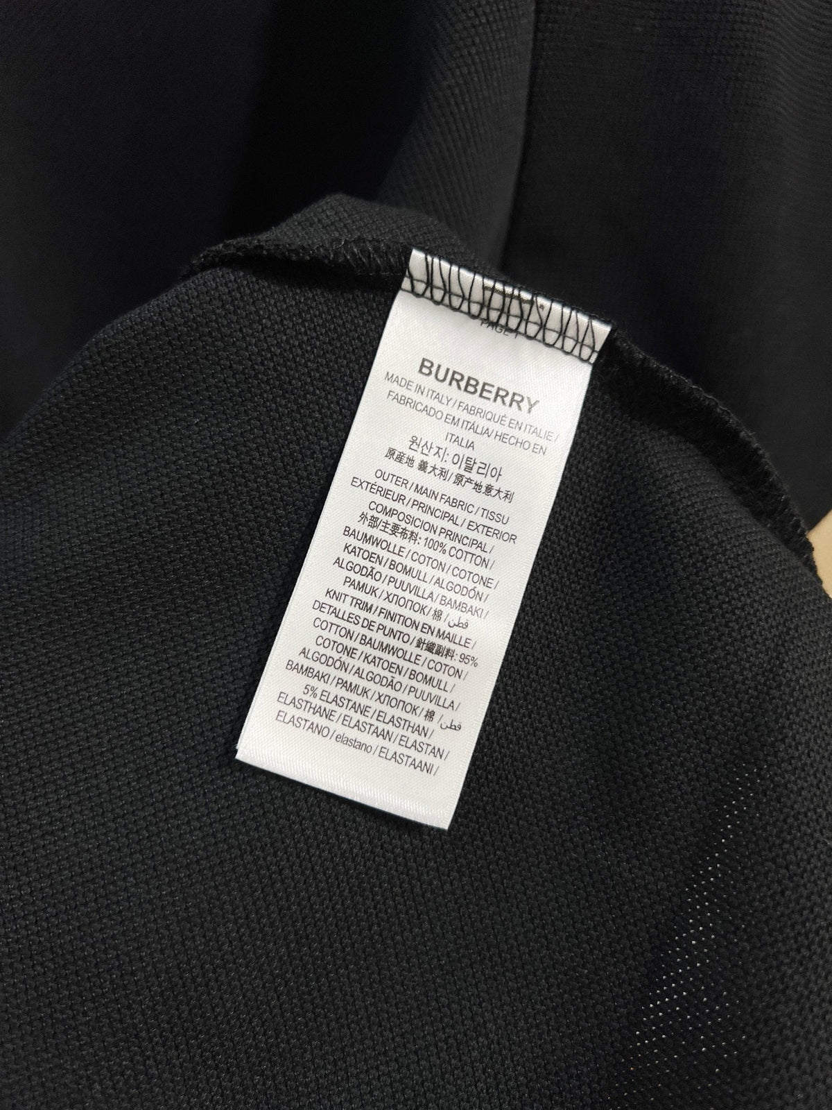 Color blocked flat machine collar with dark embroidery letters polo shirt