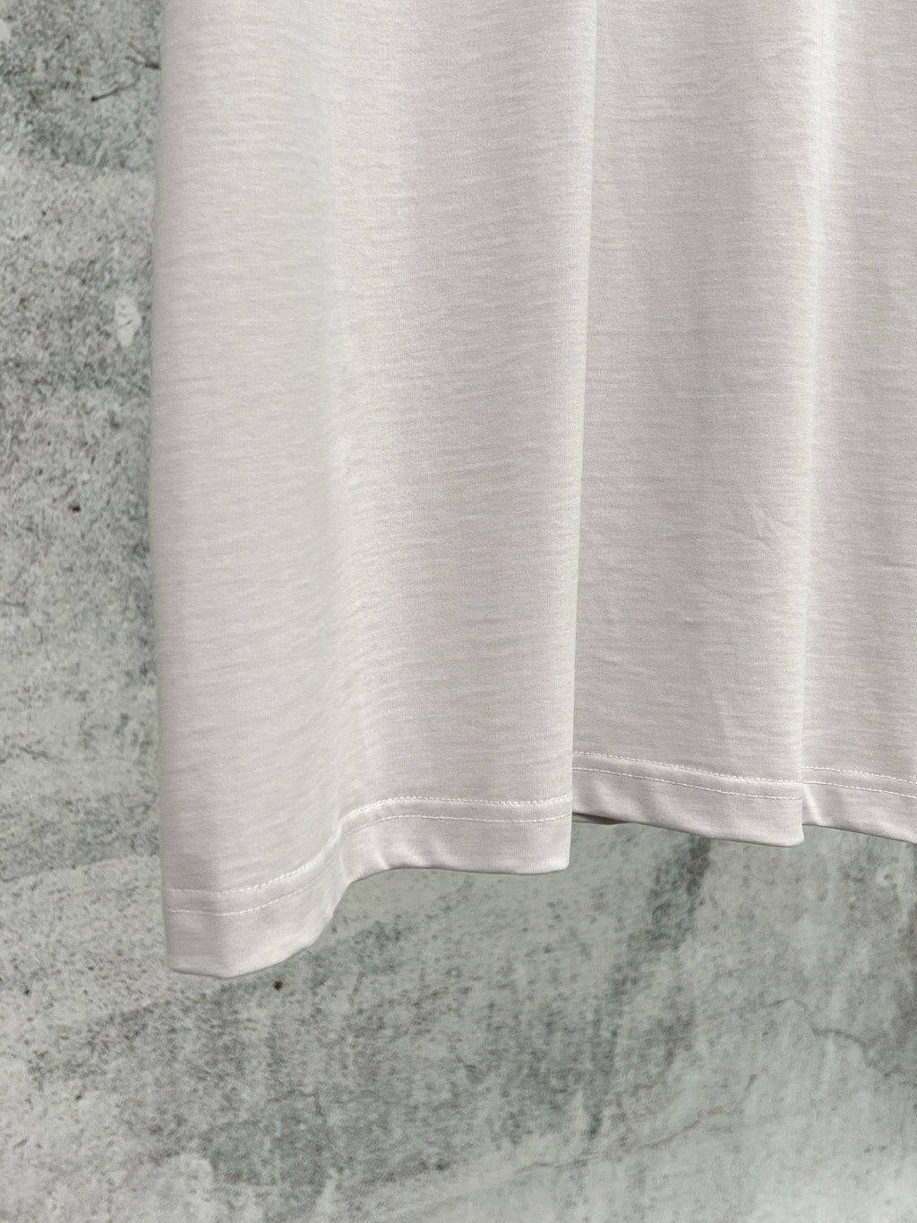 Artistic woven ribbon embellishment, washed and worn short sleeved T-shirt