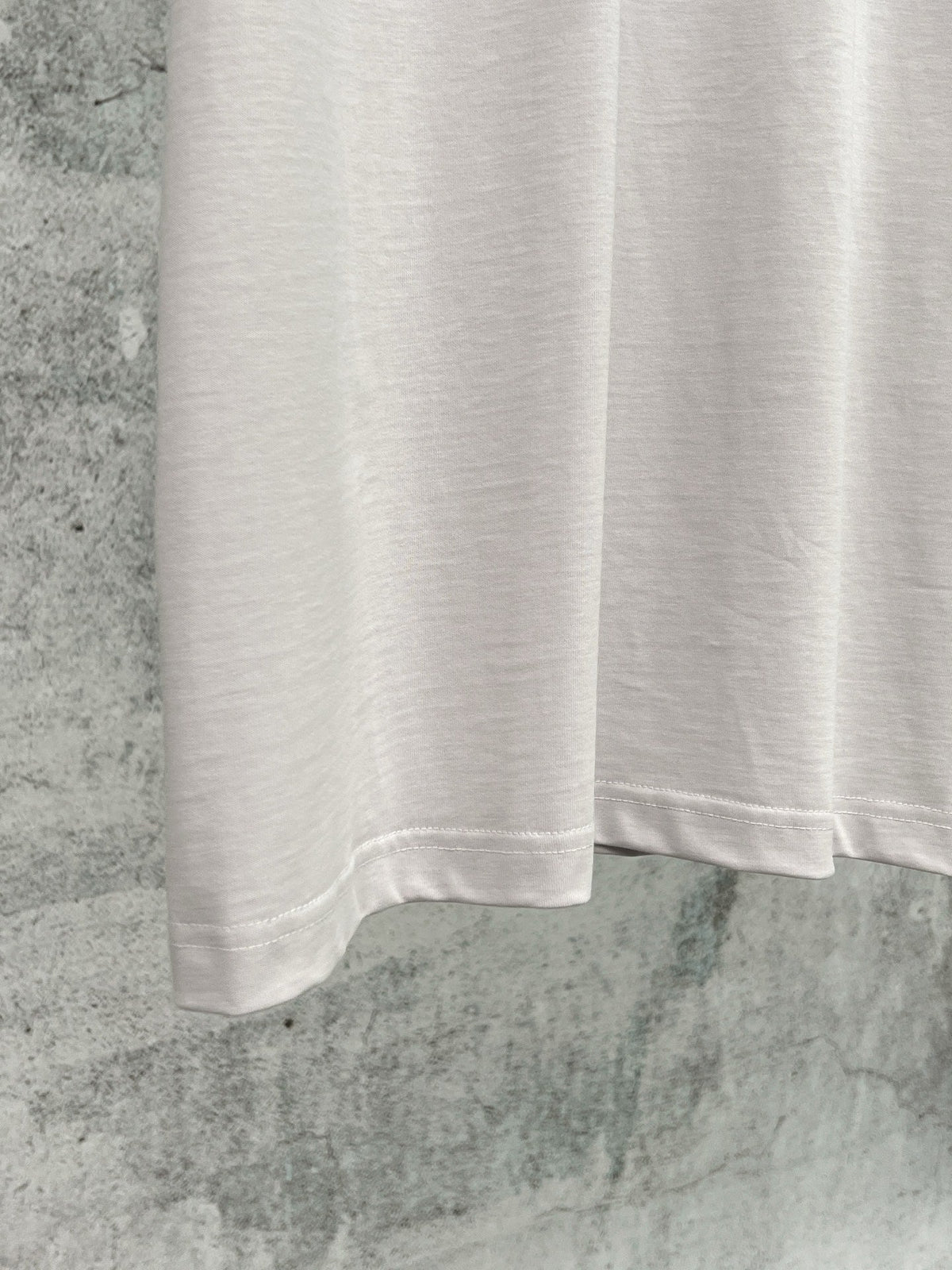 Artistic woven ribbon embellishment, washed and worn short sleeved T-shirt