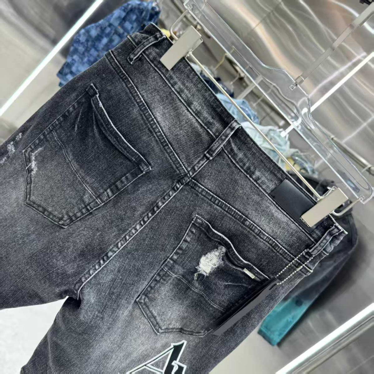 Ripped letter embroidered jeans