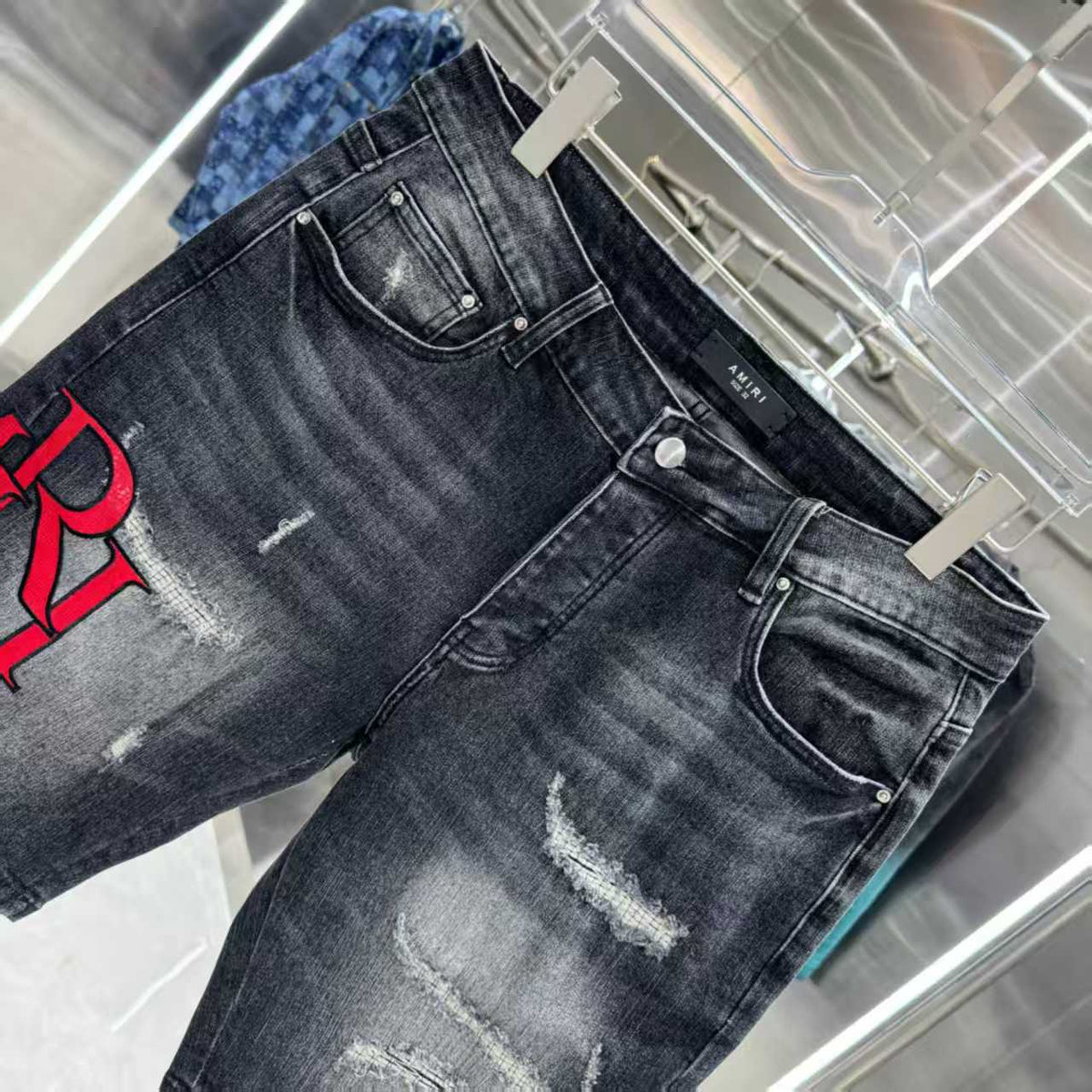 Ripped letter embroidered jeans