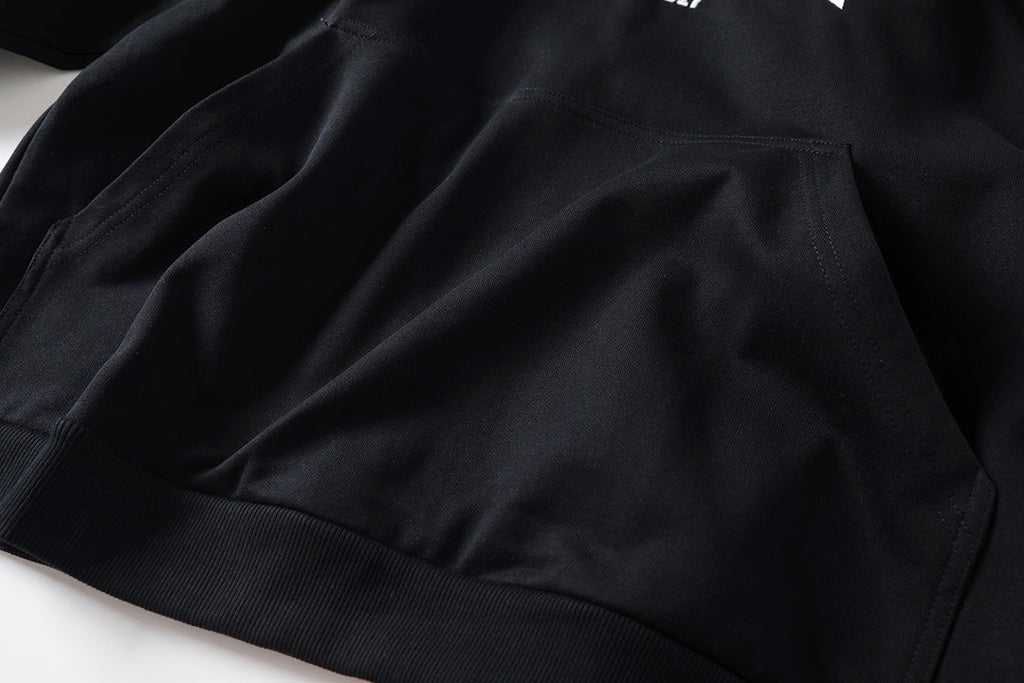 Reverse garbled letter embroidery hooded sweatshirt