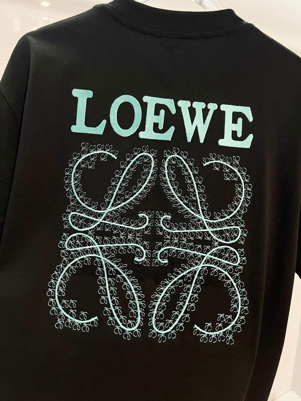 Embroidered letter t-shirt with front and back vines