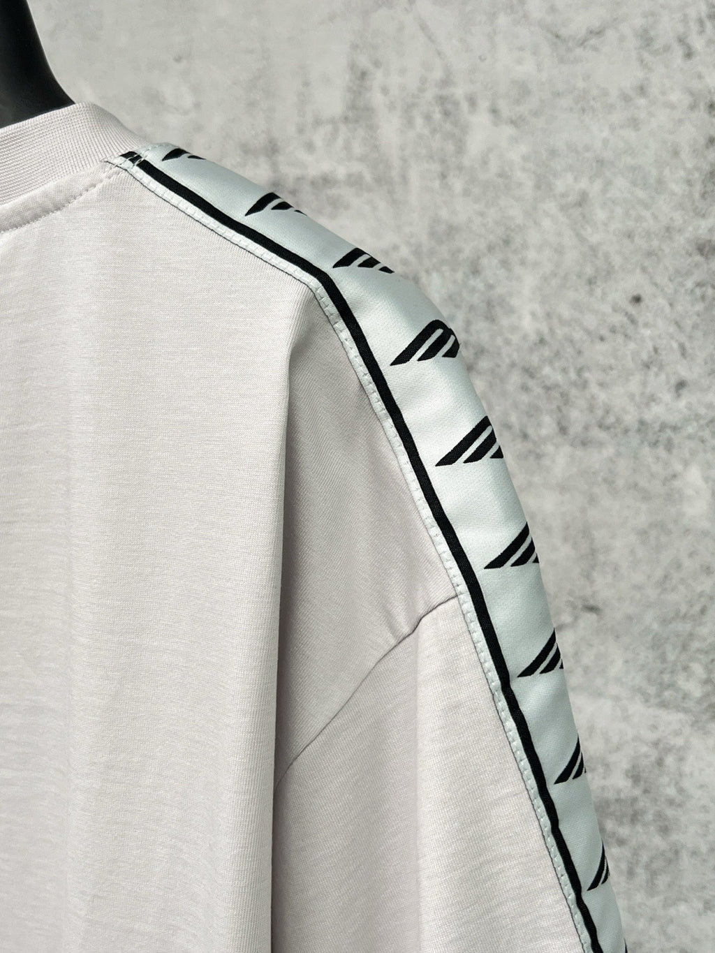 Artistic woven ribbon embellishment, washed and worn short sleeved T-shirt