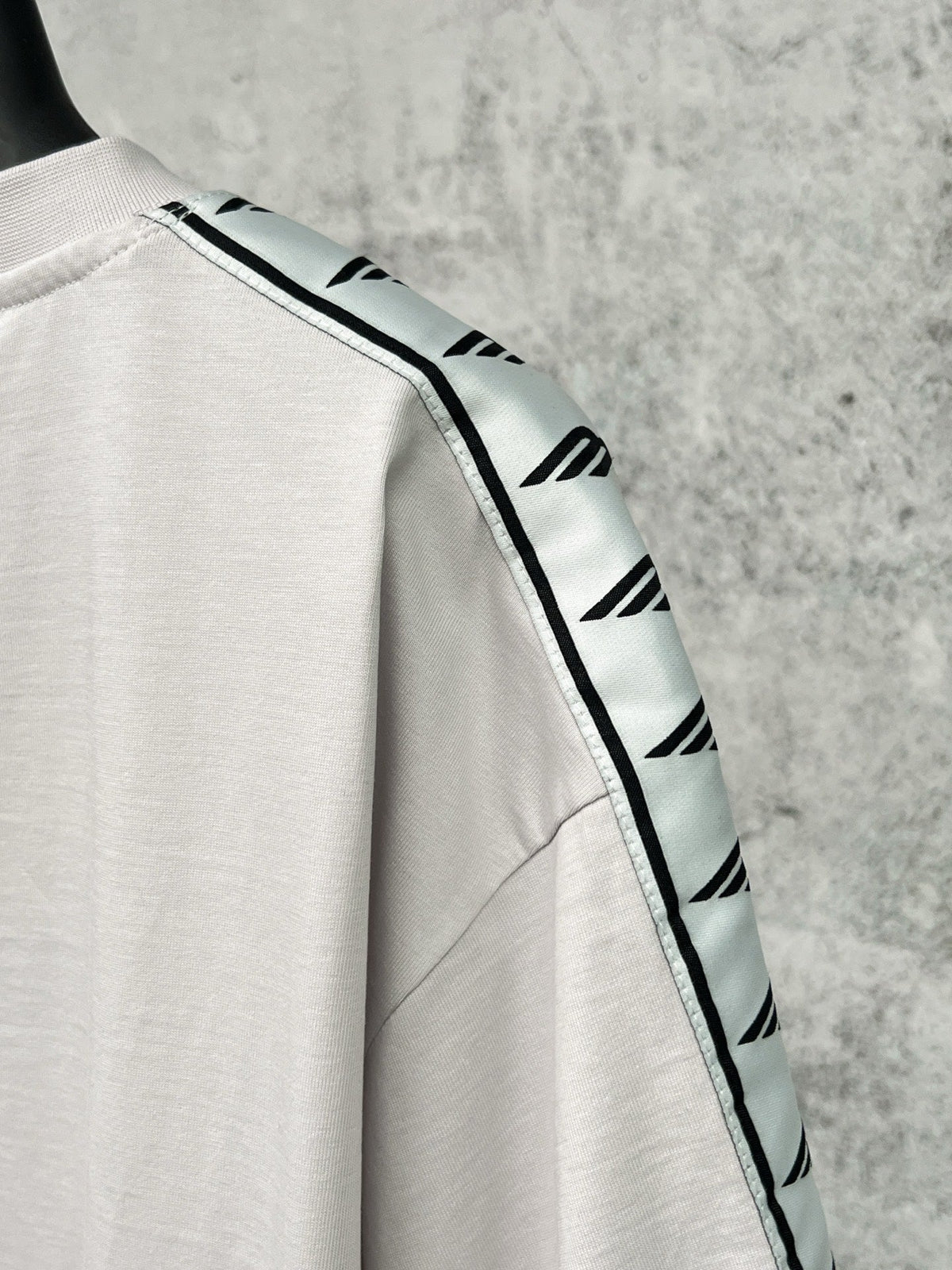 Artistic woven ribbon embellishment, washed and worn short sleeved T-shirt