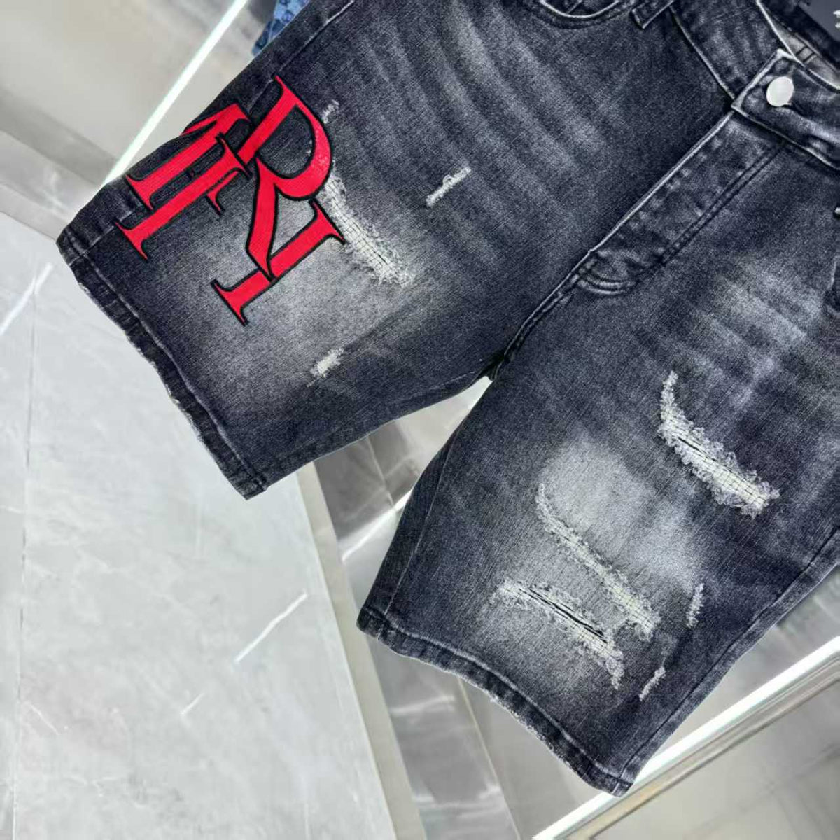 Ripped letter embroidered jeans
