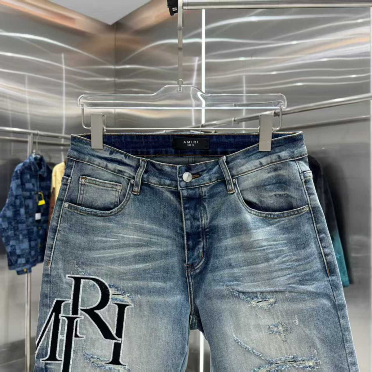 Ripped letter embroidered jeans