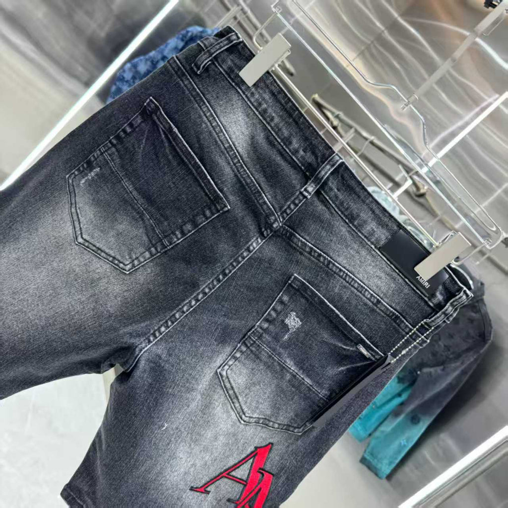 Ripped letter embroidered jeans
