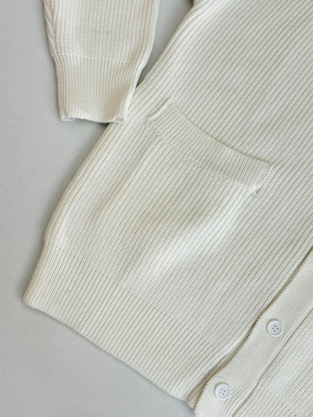 Knitted cardigan sweater with armband