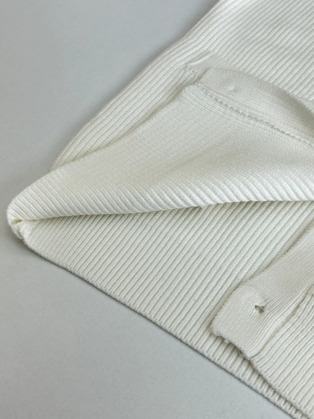 Knitted cardigan sweater with armband