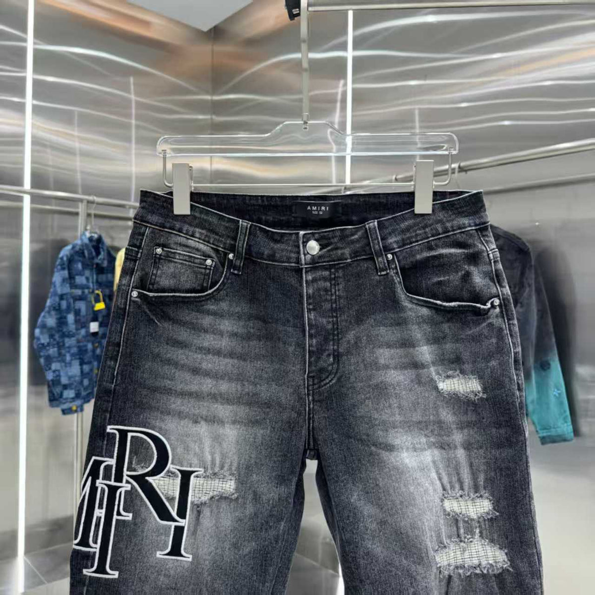 Ripped letter embroidered jeans