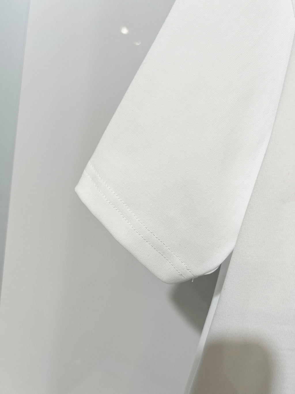 Embroidered letter t-shirt with front and back vines