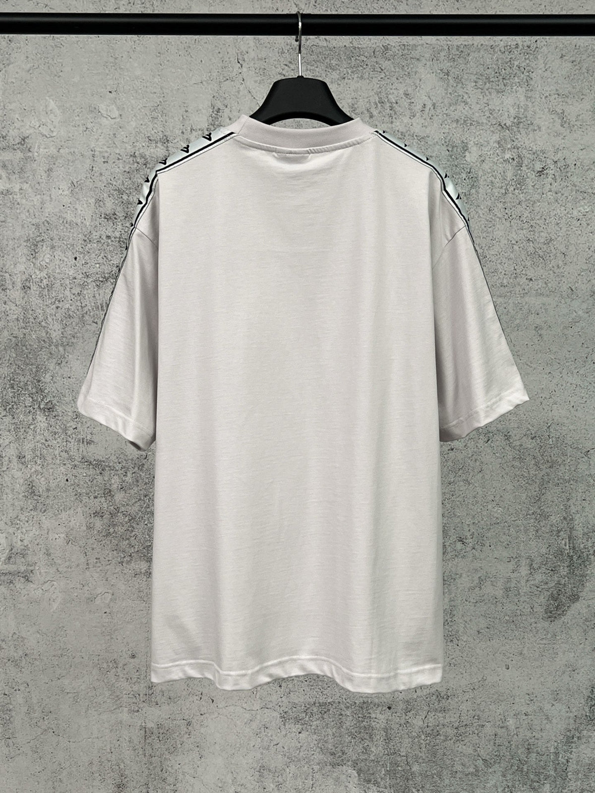 Artistic woven ribbon embellishment, washed and worn short sleeved T-shirt