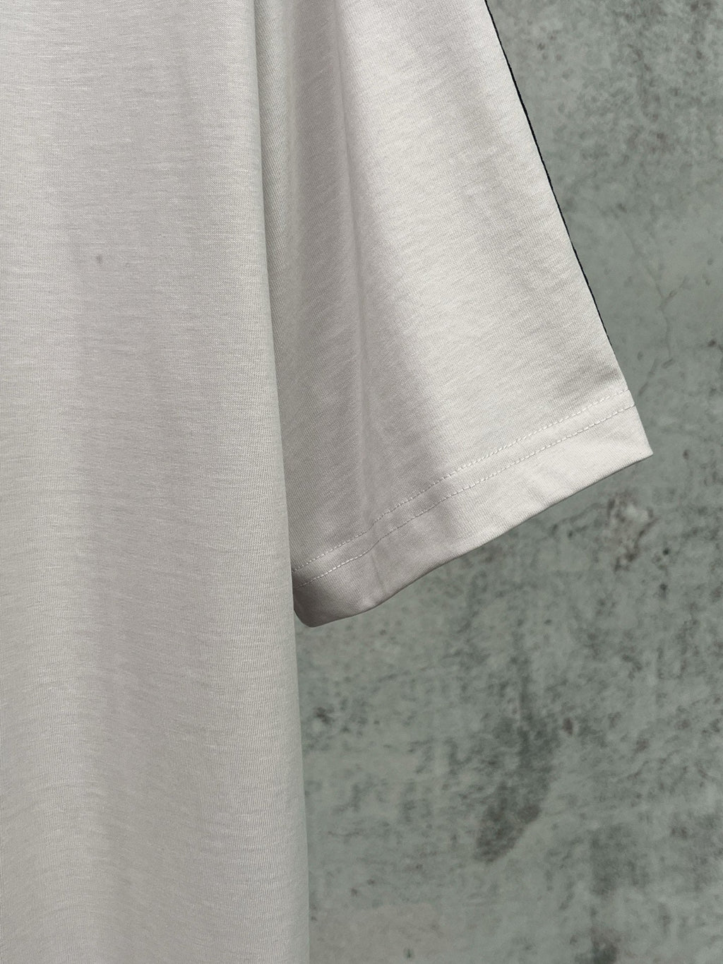 Artistic woven ribbon embellishment, washed and worn short sleeved T-shirt