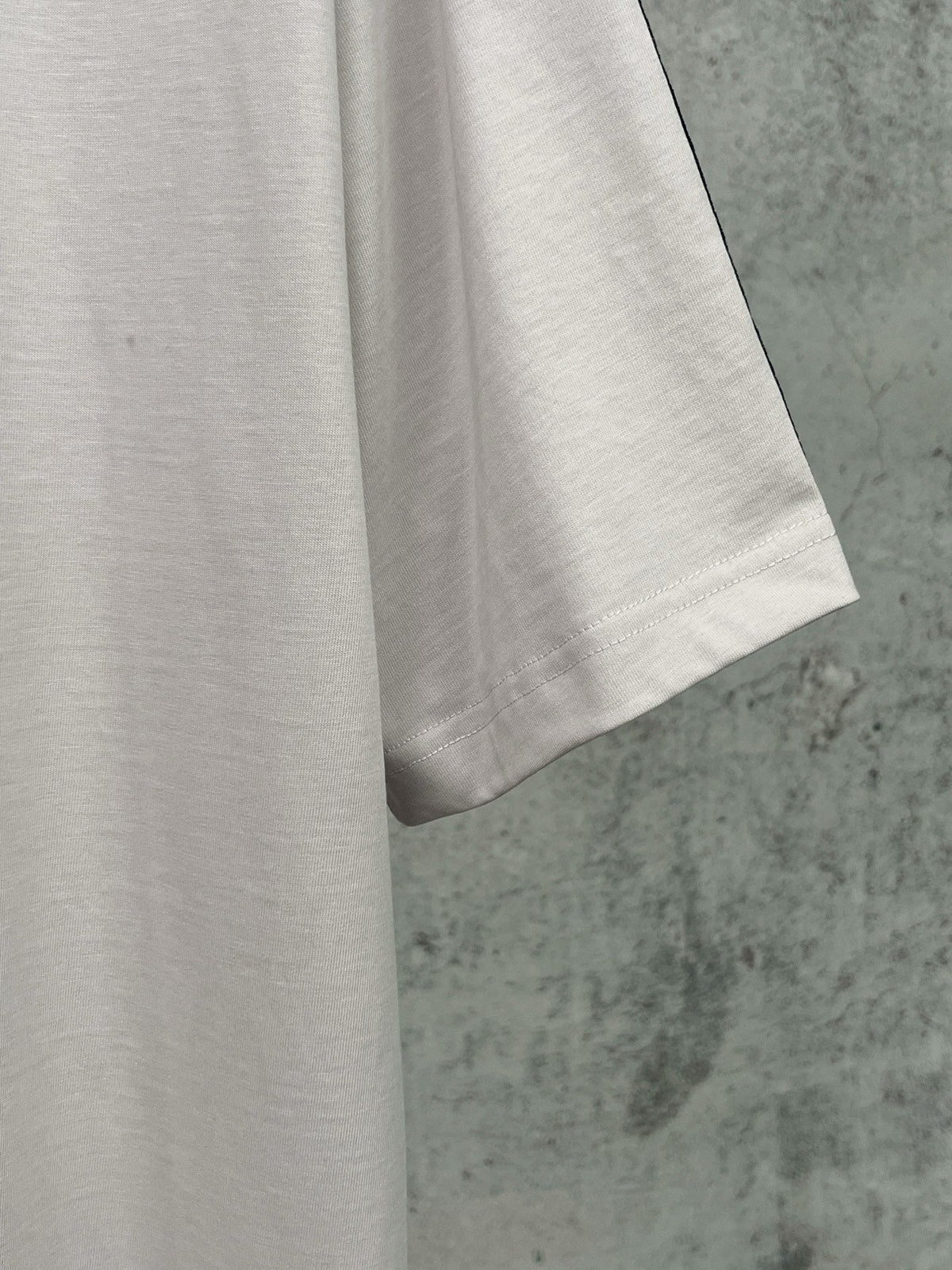 Artistic woven ribbon embellishment, washed and worn short sleeved T-shirt