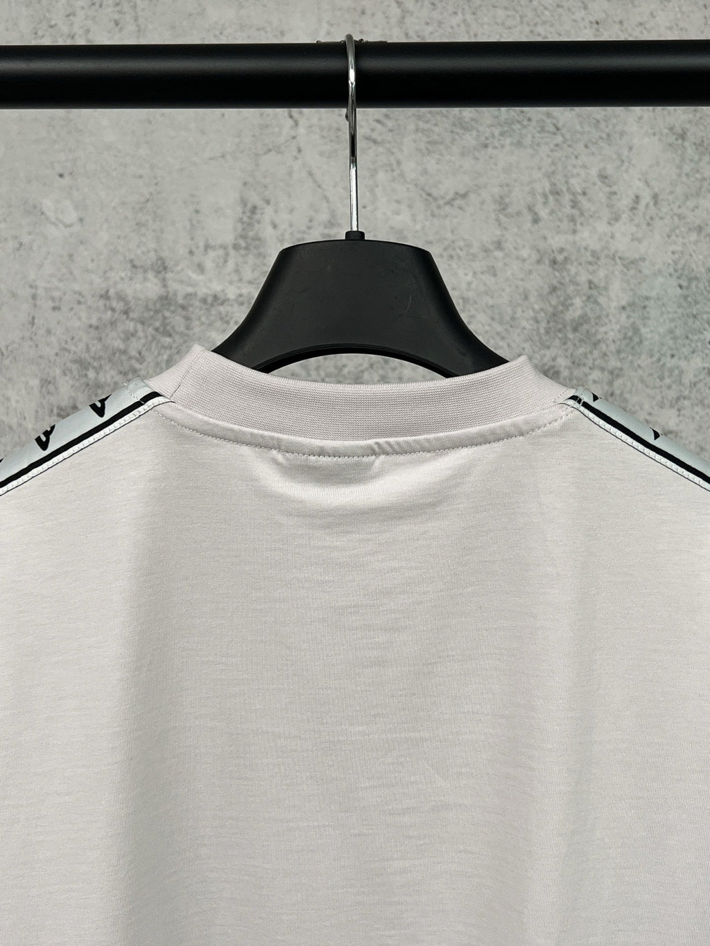 Artistic woven ribbon embellishment, washed and worn short sleeved T-shirt