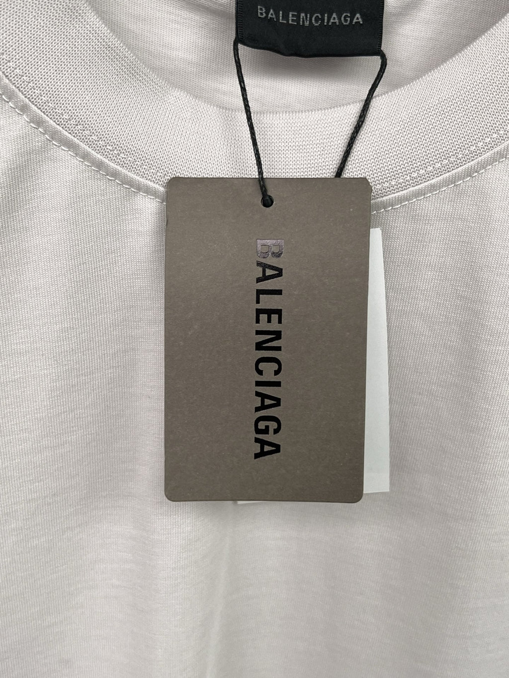 Artistic woven ribbon embellishment, washed and worn short sleeved T-shirt